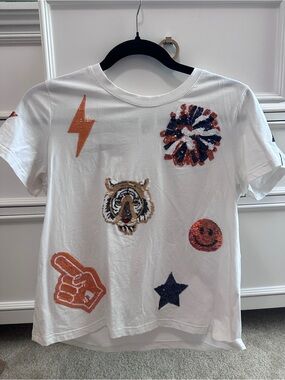 QUEEN OF SPARKLES White Short Sleeve Tee with Sequin Tiger & PomPoms
